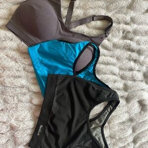 3 Sports Bras - Black, Blue and Purple-Gray.